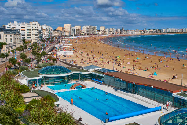 France, Vendée, Les Sables-d'Olonne, the beach in summer and the "Piscine du Remblai" swimming pool on the beach side